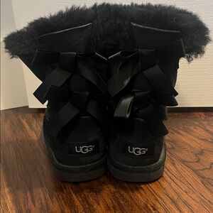 UGG Girl’s Black Furry Bow Boots